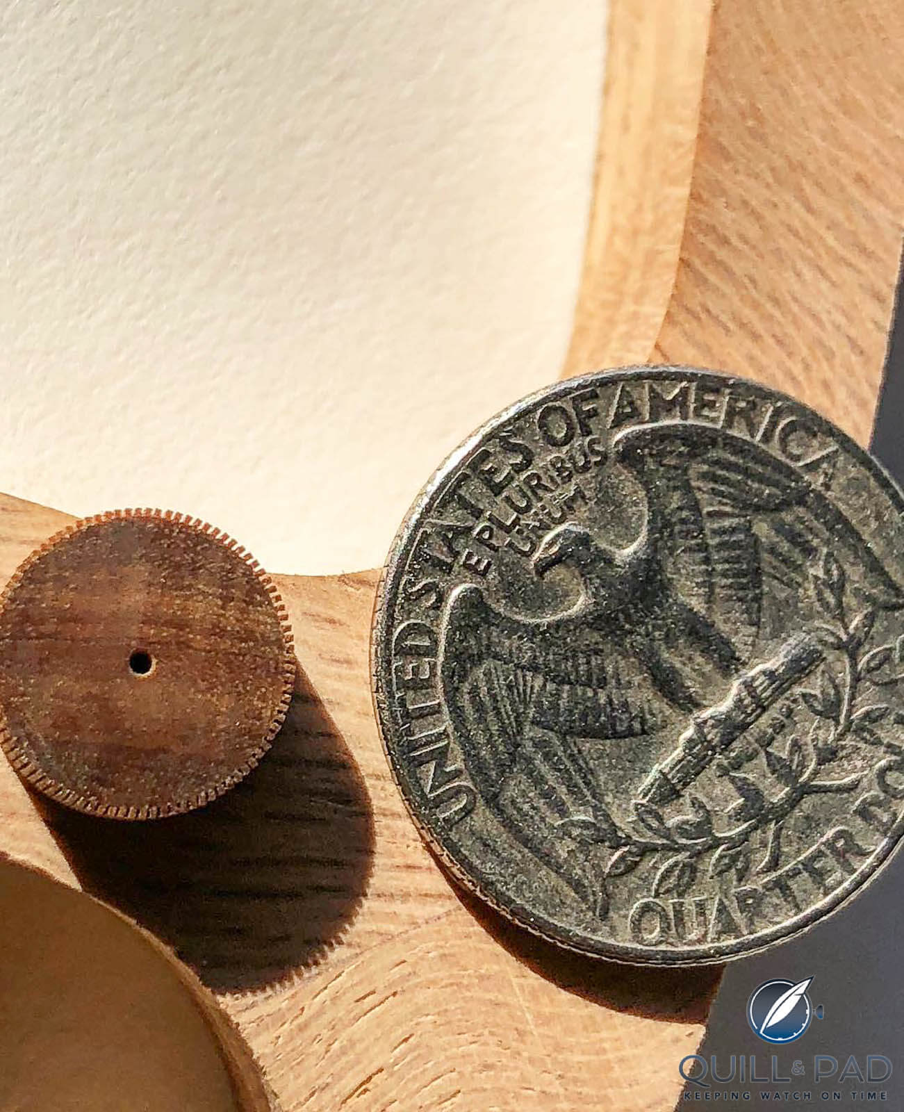 Rick Hale's smallest wood gear to date compered top a quarter coin
