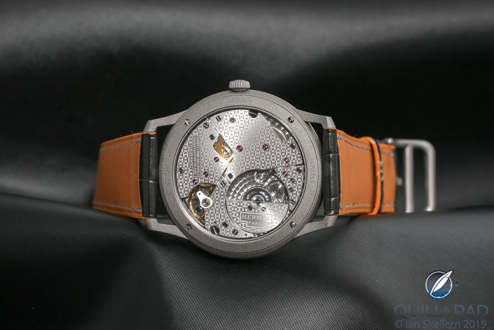 View through the display back to the miniature-H-patterned micro-rotor manufacture movement of the Slim D’Hermès Titane