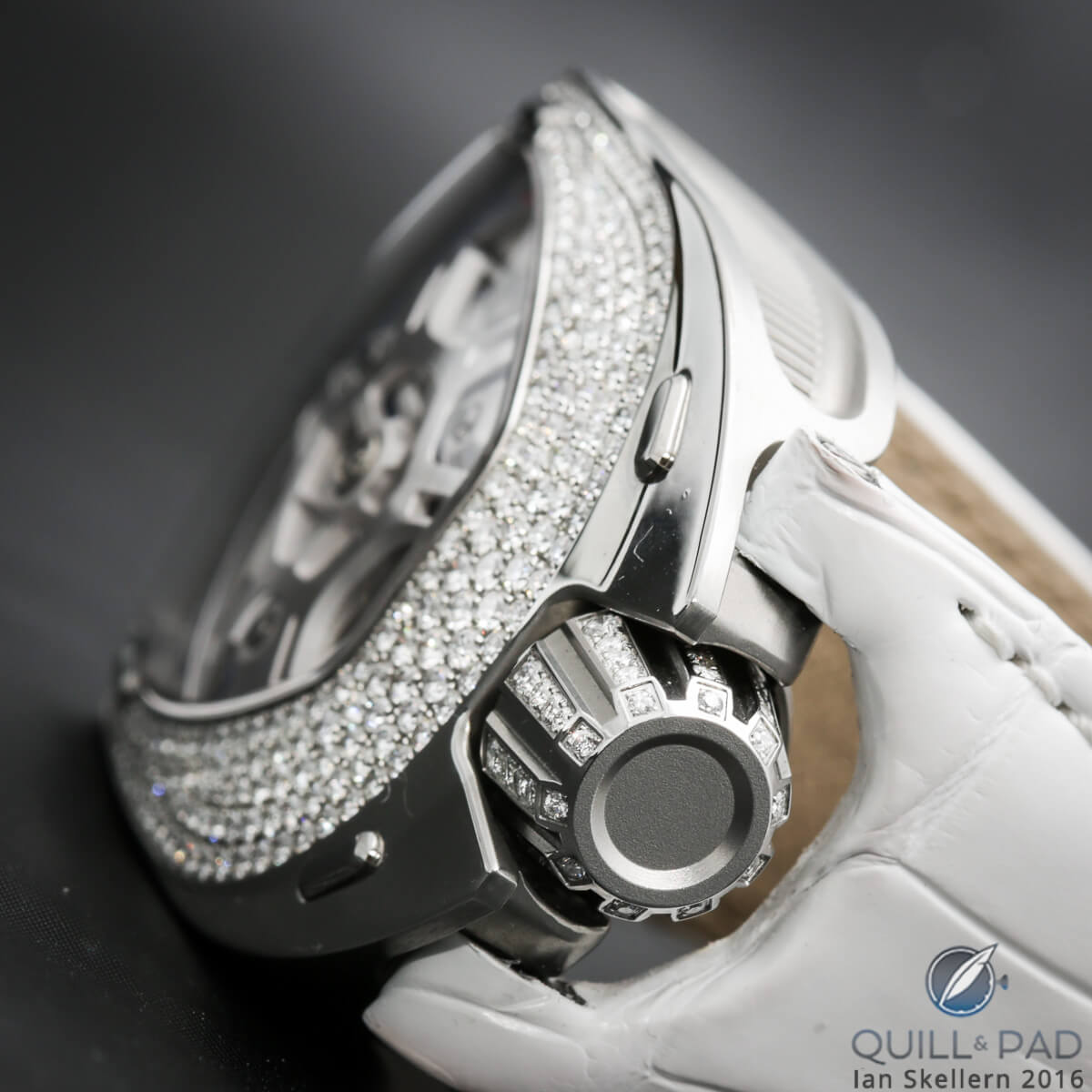 The over-sized diamond-set crown of the Urwerk UR-106 Lotus White